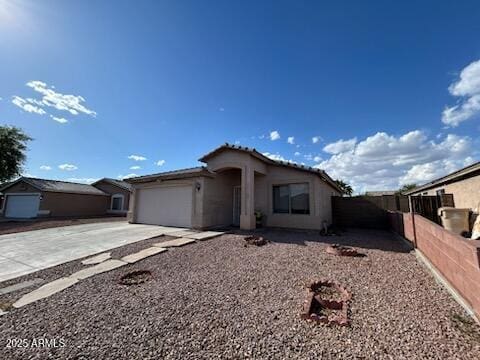 7664 W Vermont Ave, Glendale, AZ 85303 - single story home with concrete driveway, a garage, and stucco siding