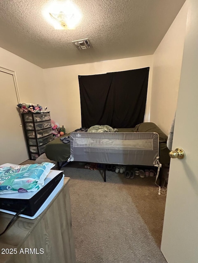 7664 W Vermont Ave, Glendale, AZ 85303 - bedroom featuring a textured ceiling and carpet