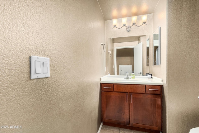 bathroom featuring tile patterned floors and vanity