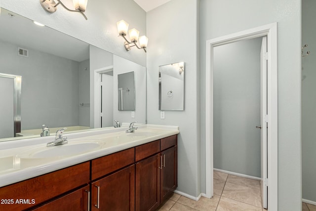 bathroom with vanity and tile patterned floors