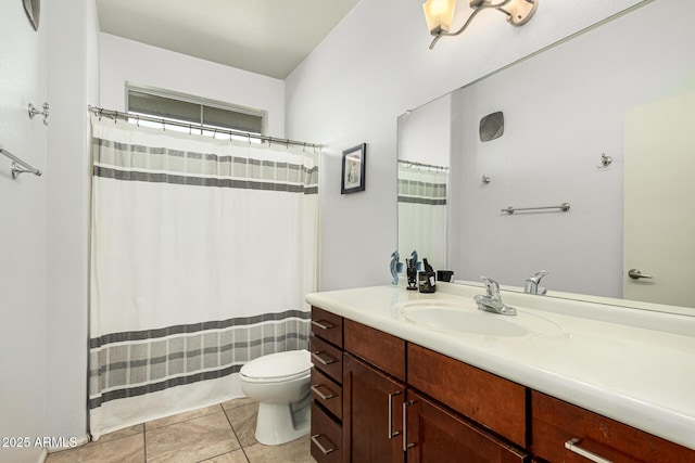 bathroom featuring tile patterned floors, vanity, and toilet