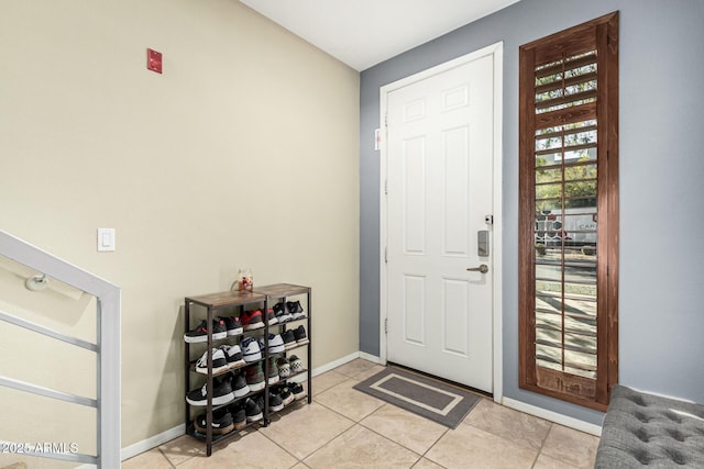 entrance foyer featuring light tile patterned floors