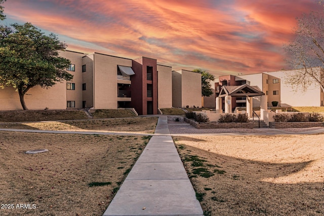 view of outdoor building at dusk