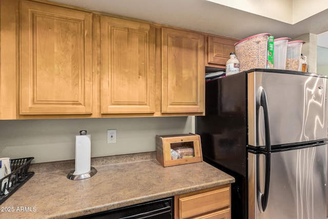 kitchen featuring stainless steel refrigerator and dishwasher