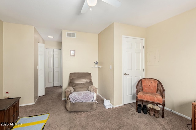 sitting room with carpet and ceiling fan