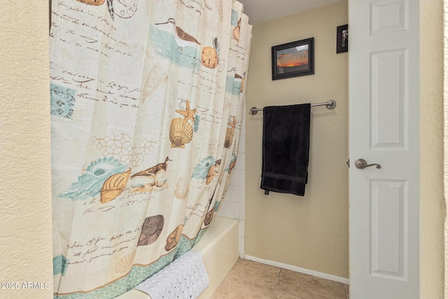 bathroom with tile patterned floors and shower / bathtub combination with curtain