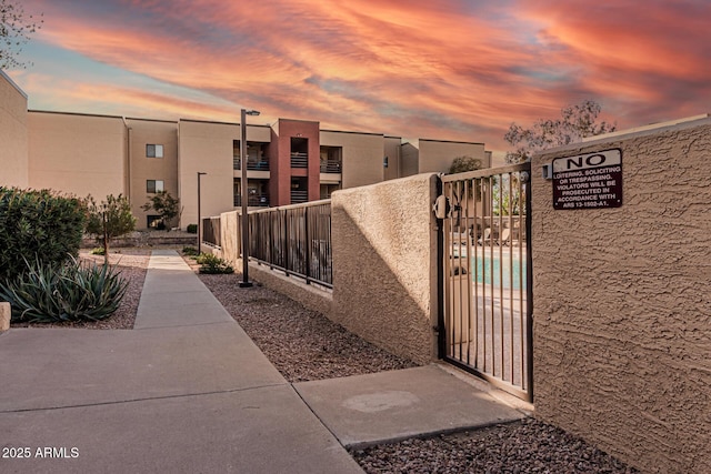 view of gate at dusk