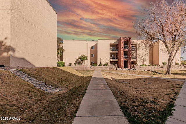 view of outdoor building at dusk