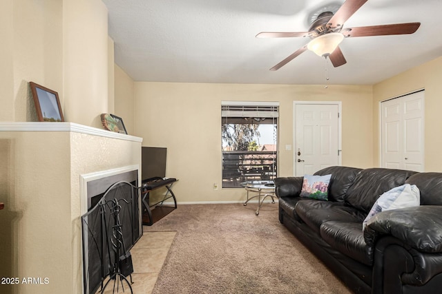 living room with ceiling fan and light colored carpet