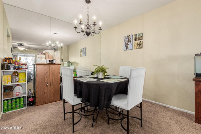 carpeted dining room featuring an inviting chandelier