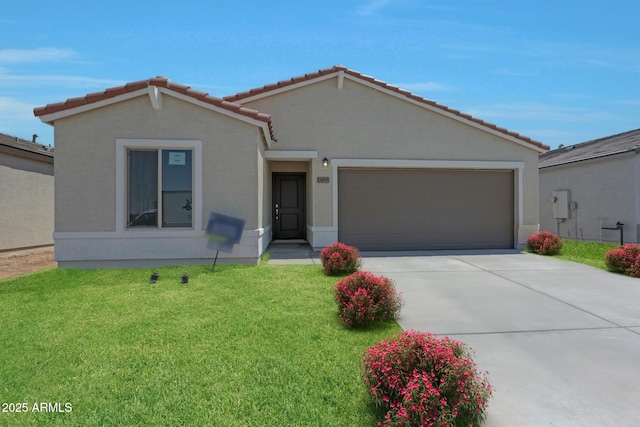 view of front of home featuring a garage and a front lawn