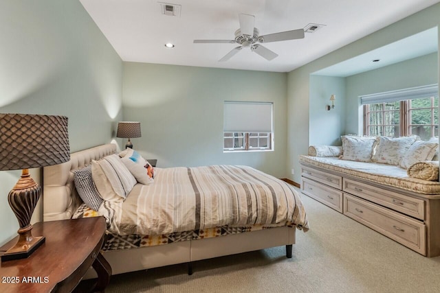 carpeted bedroom featuring recessed lighting, visible vents, and a ceiling fan