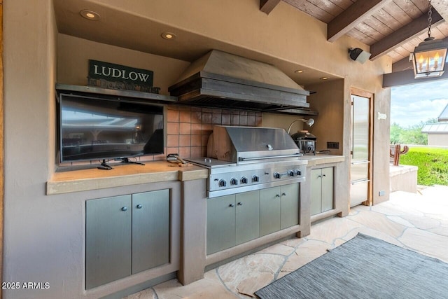 view of patio / terrace with a grill and an outdoor kitchen