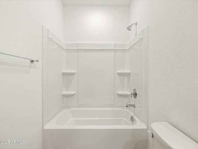 full bathroom featuring shower / bath combination and toilet