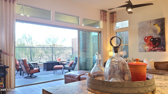 living room with light wood-type flooring and ceiling fan