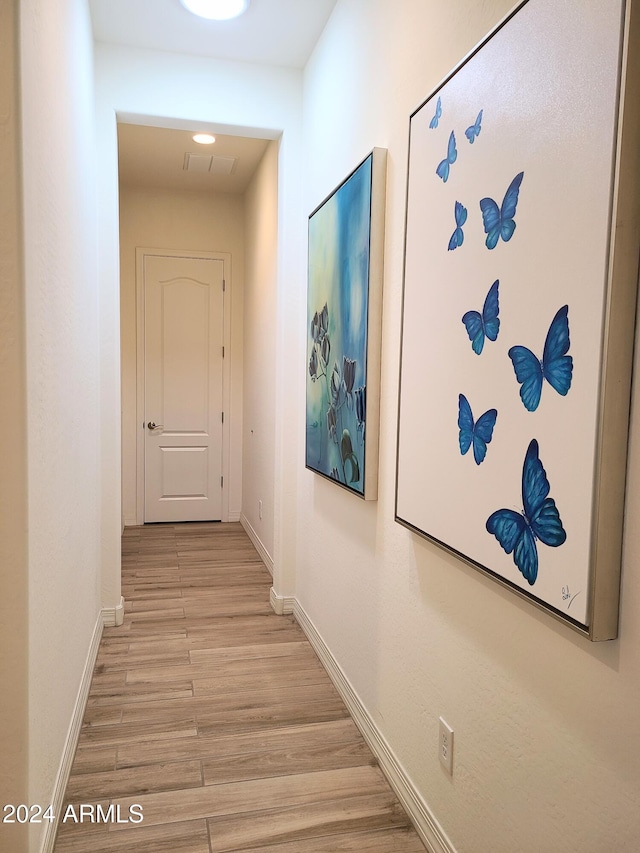 hallway featuring light wood-type flooring