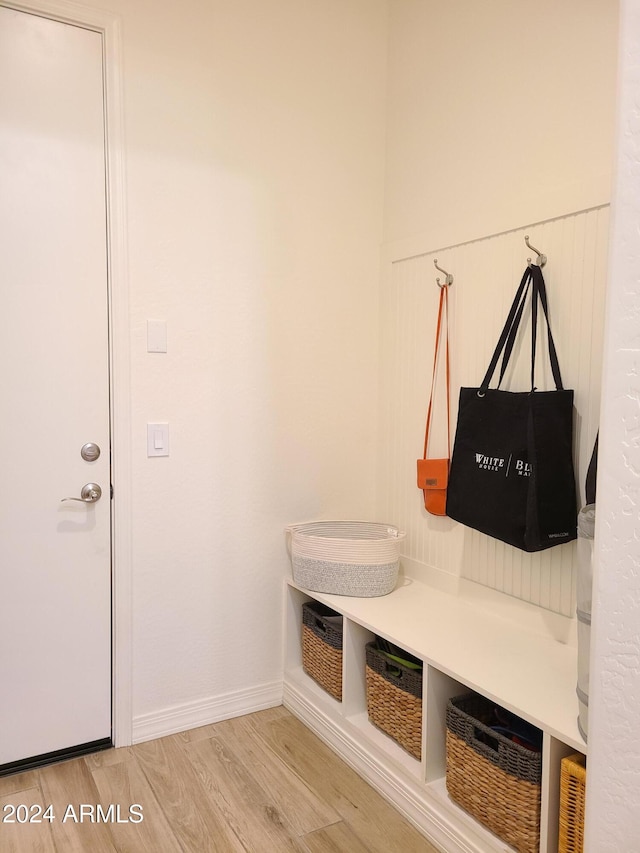 mudroom with light hardwood / wood-style floors