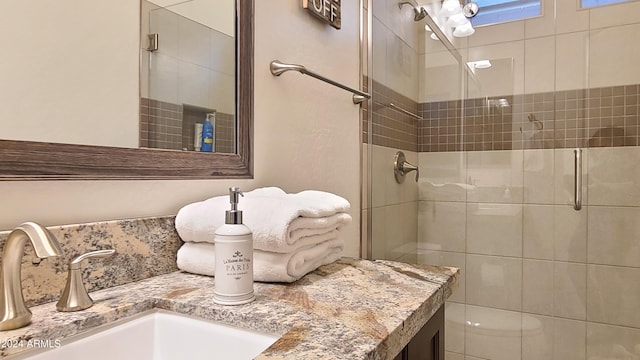 bathroom with vanity and an enclosed shower