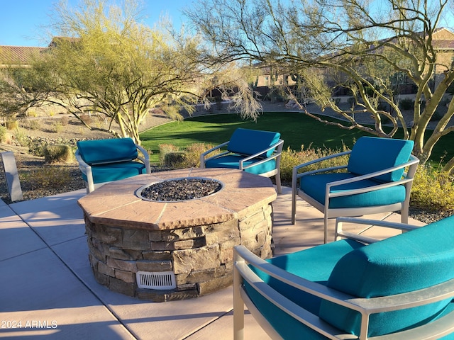 view of patio featuring an outdoor fire pit