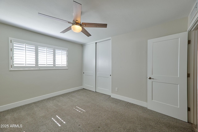 unfurnished bedroom with light colored carpet, ceiling fan, and a closet