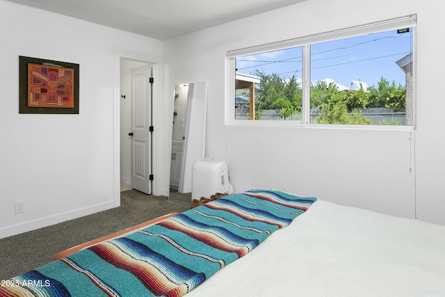 912 E Orchid Ln, Phoenix, AZ 85020 - bedroom with carpet flooring and baseboards