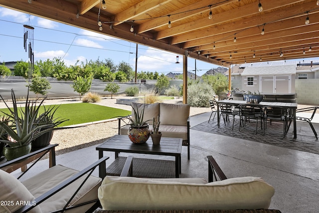 912 E Orchid Ln, Phoenix, AZ 85020 - fenced backyard featuring outdoor dining area, a patio area, outdoor lounge area, and an outbuilding