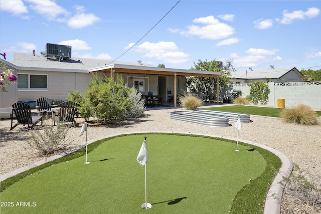 912 E Orchid Ln, Phoenix, AZ 85020 - back of property featuring a putting green and a patio