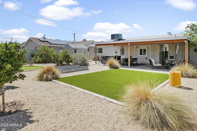 912 E Orchid Ln, Phoenix, AZ 85020 - rear view of property featuring a patio and a lawn