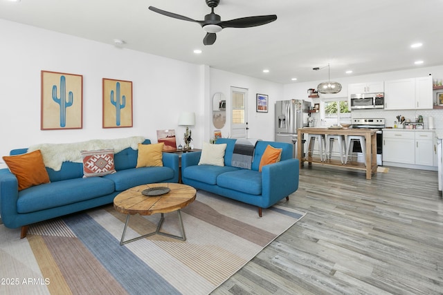 912 E Orchid Ln, Phoenix, AZ 85020 - living area with light wood finished floors, recessed lighting, and a ceiling fan