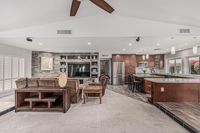 living area featuring visible vents, a ceiling fan, lofted ceiling, and recessed lighting