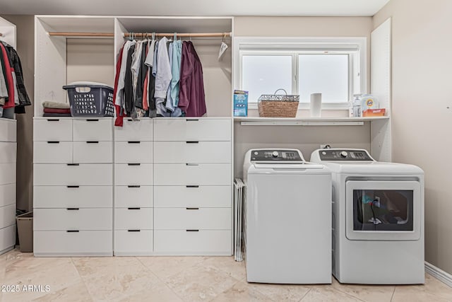 washroom with laundry area and washer and dryer