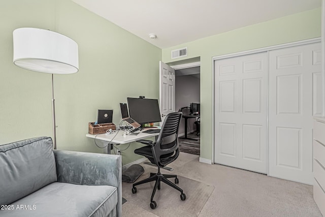 office with light colored carpet, baseboards, and visible vents