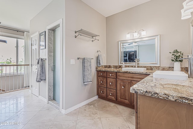 full bath featuring vanity, baseboards, and tile patterned flooring