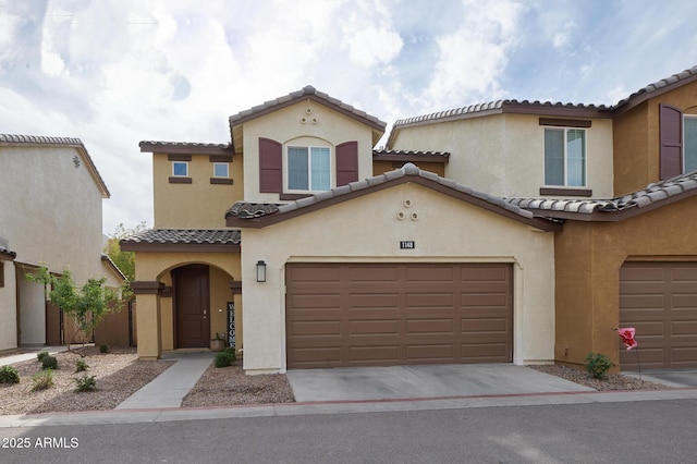 mediterranean / spanish-style house featuring a garage