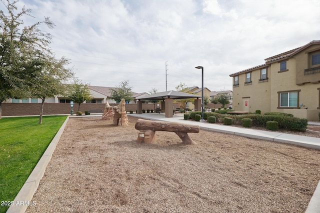 view of property's community featuring a gazebo and a yard