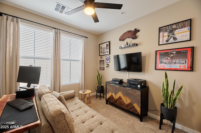 living room with carpet and ceiling fan