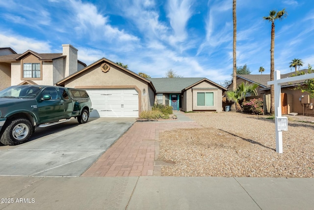 ranch-style home featuring a garage