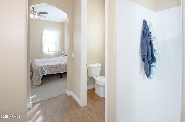 6317 E Beckett Trl, Prescott Valley, AZ 86314 - bathroom featuring baseboards, toilet, ceiling fan, wood finished floors, and ensuite bathroom