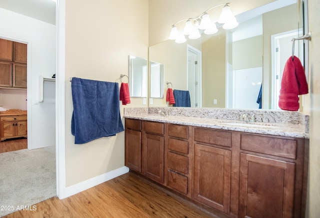 6317 E Beckett Trl, Prescott Valley, AZ 86314 - full bath featuring double vanity, a sink, baseboards, and wood finished floors