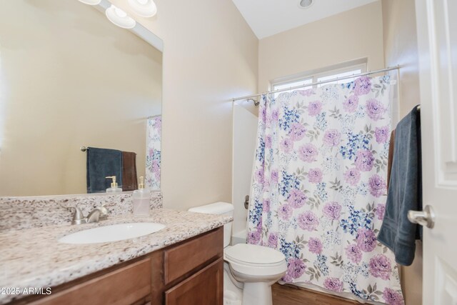 6317 E Beckett Trl, Prescott Valley, AZ 86314 - bathroom with toilet, shower / bath combo with shower curtain, wood finished floors, and vanity