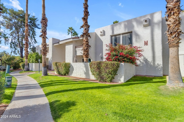 view of property exterior featuring a yard