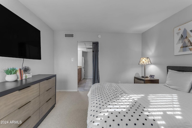 carpeted bedroom featuring a closet