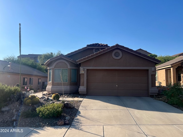 view of front of property featuring a garage