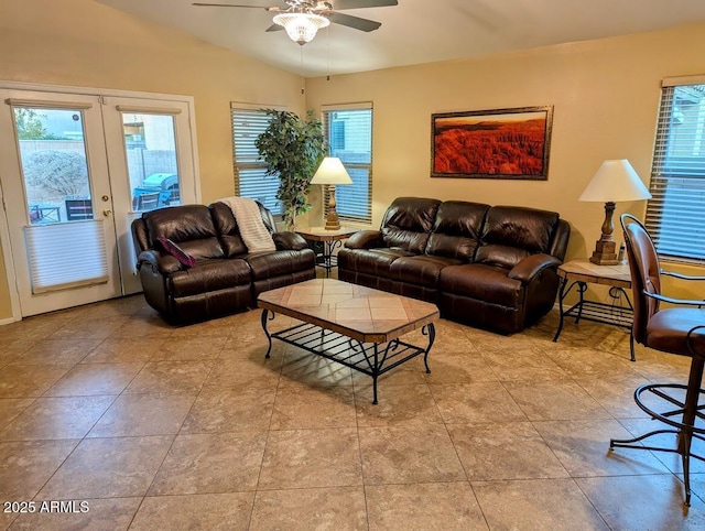 living room featuring french doors, ceiling fan, and lofted ceiling