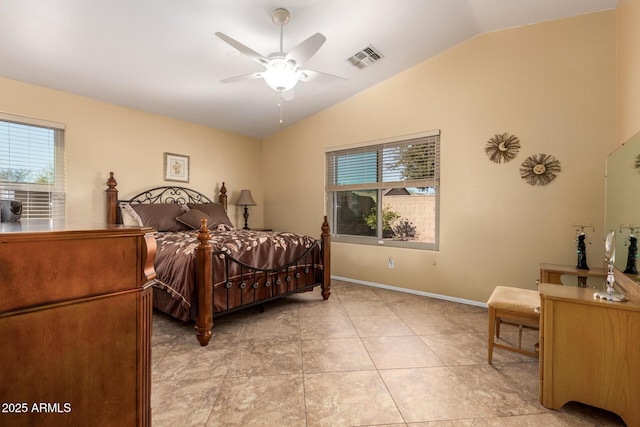 tiled bedroom with vaulted ceiling and ceiling fan