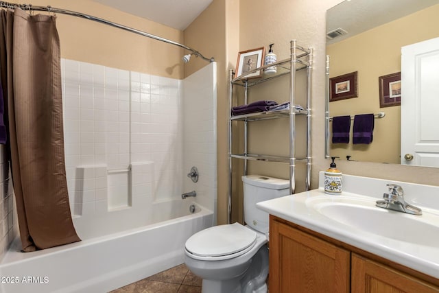 full bathroom featuring tile patterned floors, vanity, toilet, and shower / tub combo