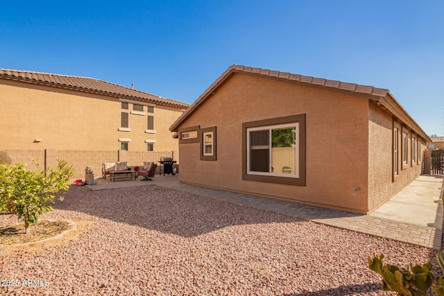 rear view of house featuring a patio area