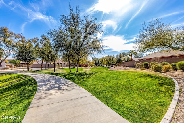 view of home's community featuring a yard