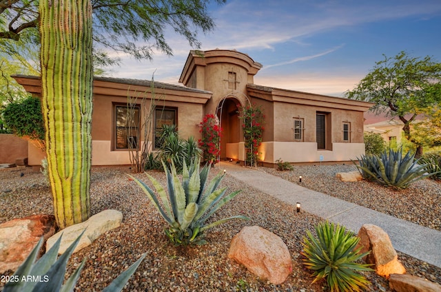 mediterranean / spanish house with stucco siding