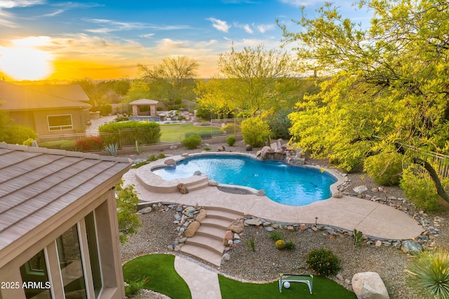 view of pool with a fenced in pool, fence, and a patio